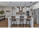 Modern kitchen with white cabinets, granite countertops, and stainless steel appliances at 7432 Ne 26Th Ave, Ocala, FL 34479