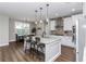 Well-lit kitchen featuring a central island with bar seating and dining area at 7432 Ne 26Th Ave, Ocala, FL 34479