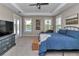 Spacious main bedroom with pool view, neutral decor, and ample natural light at 7432 Ne 26Th Ave, Ocala, FL 34479