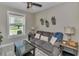 Cozy sitting room features comfortable seating, natural light, and a view of the serene outdoors at 7432 Ne 26Th Ave, Ocala, FL 34479