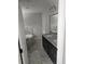 Bathroom displays a garden tub with tiled walls, dual sink granite counters and modern fixtures at 7677 Sw 81St Pl, Ocala, FL 34476