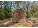 This backyard shed features a natural wood finish at 9607 Se 122Nd Pl, Belleview, FL 34420