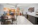Bright kitchen featuring ample counter space, oak cabinets, stainless steel appliances, and a tiled floor at 9770 Sw 97Th Pl, Ocala, FL 34481