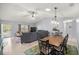 Inviting living room and dining area with tile floors, skylight and ceiling fan at 9770 Sw 97Th Pl, Ocala, FL 34481
