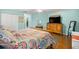 Bright main bedroom with hardwood floors, closet space, and modern decor at 9770 Sw 97Th Pl, Ocala, FL 34481