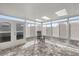 Bright sunroom with white framing and lots of natural light with brick flooring at 9770 Sw 97Th Pl, Ocala, FL 34481