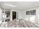 Bright sunroom with white walls, brick flooring, and multiple points of entry at 9770 Sw 97Th Pl, Ocala, FL 34481
