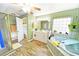 Relaxing bathroom features a garden tub, decorative tile accents, and a separate shower at 9795 Ne 303Rd Ave, Salt Springs, FL 32134