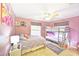 Cozy bedroom provides a single bed, bunk beds, and great natural light through two windows at 9795 Ne 303Rd Ave, Salt Springs, FL 32134
