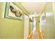 Bright hallway with hardwood floors, a closet, and artwork creates a seamless transition between living spaces at 9795 Ne 303Rd Ave, Salt Springs, FL 32134