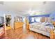Spacious main bedroom features wood floors, walk-in closet, and a comfortable window seat at 9795 Ne 303Rd Ave, Salt Springs, FL 32134