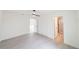 Spacious bedroom with a ceiling fan, modern flooring, a closet and an en suite bathroom with glass shower at 10069 Sw 140Th Ave, Dunnellon, FL 34432