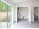 Bright laundry room with modern flooring, a large window, and an utility closet with water heater and hook-ups at 10069 Sw 140Th Ave, Dunnellon, FL 34432