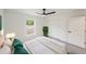 Bright main bedroom features a ceiling fan and closet at 10069 Sw 140Th Ave, Dunnellon, FL 34432