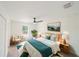 Serene main bedroom with natural light, a ceiling fan, and stylish decor at 10069 Sw 140Th Ave, Dunnellon, FL 34432