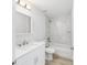 Stylish bathroom features a vanity with countertop, white cabinetry and tiled shower with bathtub at 13395 Sw 106 St, Dunnellon, FL 34432
