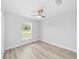 Bedroom featuring laminate flooring, natural light and ceiling fan at 13395 Sw 106 St, Dunnellon, FL 34432
