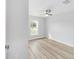 Bright room with laminate flooring, window and ceiling fan at 13395 Sw 106 St, Dunnellon, FL 34432