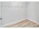Empty closet with laminate floors and shelf at 13395 Sw 106 St, Dunnellon, FL 34432