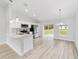 Open-concept kitchen featuring recessed lighting, quartz countertops, and stainless steel appliances at 13395 Sw 106 St, Dunnellon, FL 34432