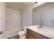 Bathroom with tub, white marble tile and vanity with large mirror at 13627 Sw 103Rd Pl, Dunnellon, FL 34432