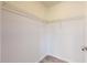 Walk-in closet with wire shelving installed, featuring laminate flooring and white walls at 13627 Sw 103Rd Pl, Dunnellon, FL 34432