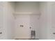 A well-lit closet featuring wire shelving and convenient utility connections at 13627 Sw 103Rd Pl, Dunnellon, FL 34432