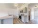 Well-lit kitchen with gray cabinets, stainless steel appliances, and granite countertops at 13627 Sw 103Rd Pl, Dunnellon, FL 34432