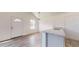 Living area featuring wood-look floors, stone countertops, and modern fixtures at 13627 Sw 103Rd Pl, Dunnellon, FL 34432