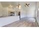 Bright living room featuring wood-style flooring, recessed lighting, and a ceiling fan at 13627 Sw 103Rd Pl, Dunnellon, FL 34432