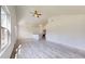 Spacious living room with modern flooring, recessed lighting, and an open layout at 13627 Sw 103Rd Pl, Dunnellon, FL 34432