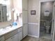 Neutral bathroom featuring a single sink vanity, toilet, and tiled floors at 13686 Sw 111Th Ave, Dunnellon, FL 34432