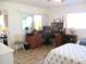 Bedroom featuring a desk workspace, ceiling fan, and bright natural light at 13686 Sw 111Th Ave, Dunnellon, FL 34432