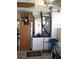 HVAC equipment in garage with storage and blue chair at 13686 Sw 111Th Ave, Dunnellon, FL 34432