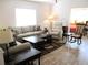 Inviting living room with plush sofas, contemporary tables, and tile flooring at 13686 Sw 111Th Ave, Dunnellon, FL 34432