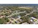 Expansive aerial of residential area featuring mature trees, quiet streets, and diverse single-Gathering homes at 16272 Se 89Th Ct, Summerfield, FL 34491