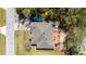 Birds-eye view of house featuring patio, outdoor furniture, hot tub, and boat in the driveway at 16272 Se 89Th Ct, Summerfield, FL 34491