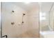 Modern bathroom with sleek tile in the shower and glass door at 16272 Se 89Th Ct, Summerfield, FL 34491