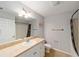 Bathroom boasting a vanity with a framed mirror and a tiled floor at 16272 Se 89Th Ct, Summerfield, FL 34491