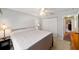 Bright bedroom with a neutral color palette and a double door closet at 16272 Se 89Th Ct, Summerfield, FL 34491