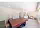 Spacious, enclosed patio with ceiling fan and pool table; great for recreation at 16272 Se 89Th Ct, Summerfield, FL 34491