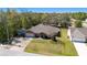 Well-kept single-Gathering home with a green lawn, mature trees, and a private driveway in a quiet neighborhood at 16272 Se 89Th Ct, Summerfield, FL 34491