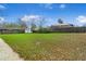 Large backyard with a shed and a wooden fence at 1818 Se Lake Weir Ave, Ocala, FL 34471