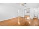 Spacious bedroom boasts hardwood floors, ceiling fan, and closet with mirror sliding doors at 1818 Se Lake Weir Ave, Ocala, FL 34471