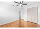 Bright bedroom boasts hardwood floors, ceiling fan and closet at 1818 Se Lake Weir Ave, Ocala, FL 34471