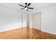 Bright bedroom with a ceiling fan, closet, and wood flooring at 1818 Se Lake Weir Ave, Ocala, FL 34471