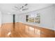 Inviting living room featuring hardwood floors, natural light, and a ceiling fan at 1818 Se Lake Weir Ave, Ocala, FL 34471