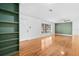 Bright living room featuring hardwood floors, ample natural light, and built-in bookshelves at 1818 Se Lake Weir Ave, Ocala, FL 34471