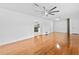 Open living room with hardwood floors, neutral walls, and a ceiling fan at 1818 Se Lake Weir Ave, Ocala, FL 34471