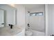 Bright bathroom featuring a shower and tub combination, with a sleek vanity at 19 Juniper Pass, Ocala, FL 34480